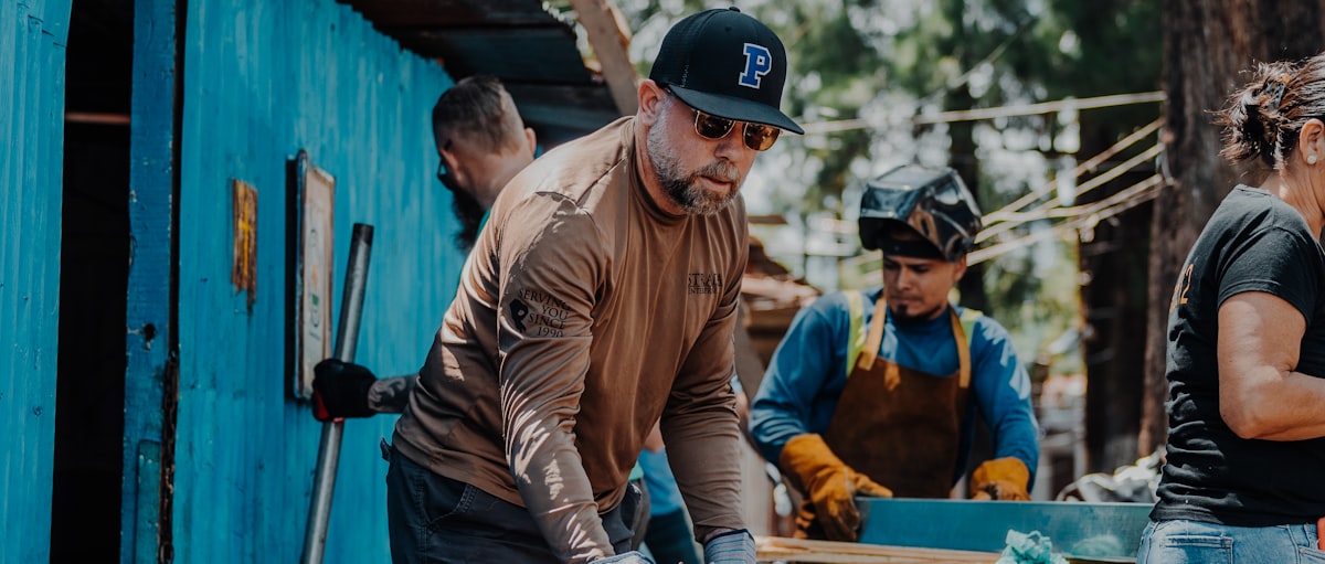 A missions team working together on a construction site